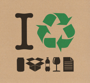 Recycling sign that uses images to say "I recycle bottles, paper, plastic etc.