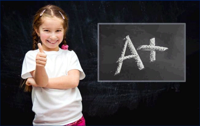 Little girl giving thumbs up in front of blackboard on which A+ is written in chalk