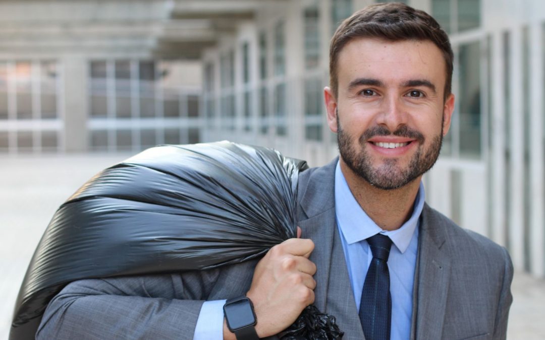 Reduce waste costs at work|Biz man with garbage bag slung over his shoulder