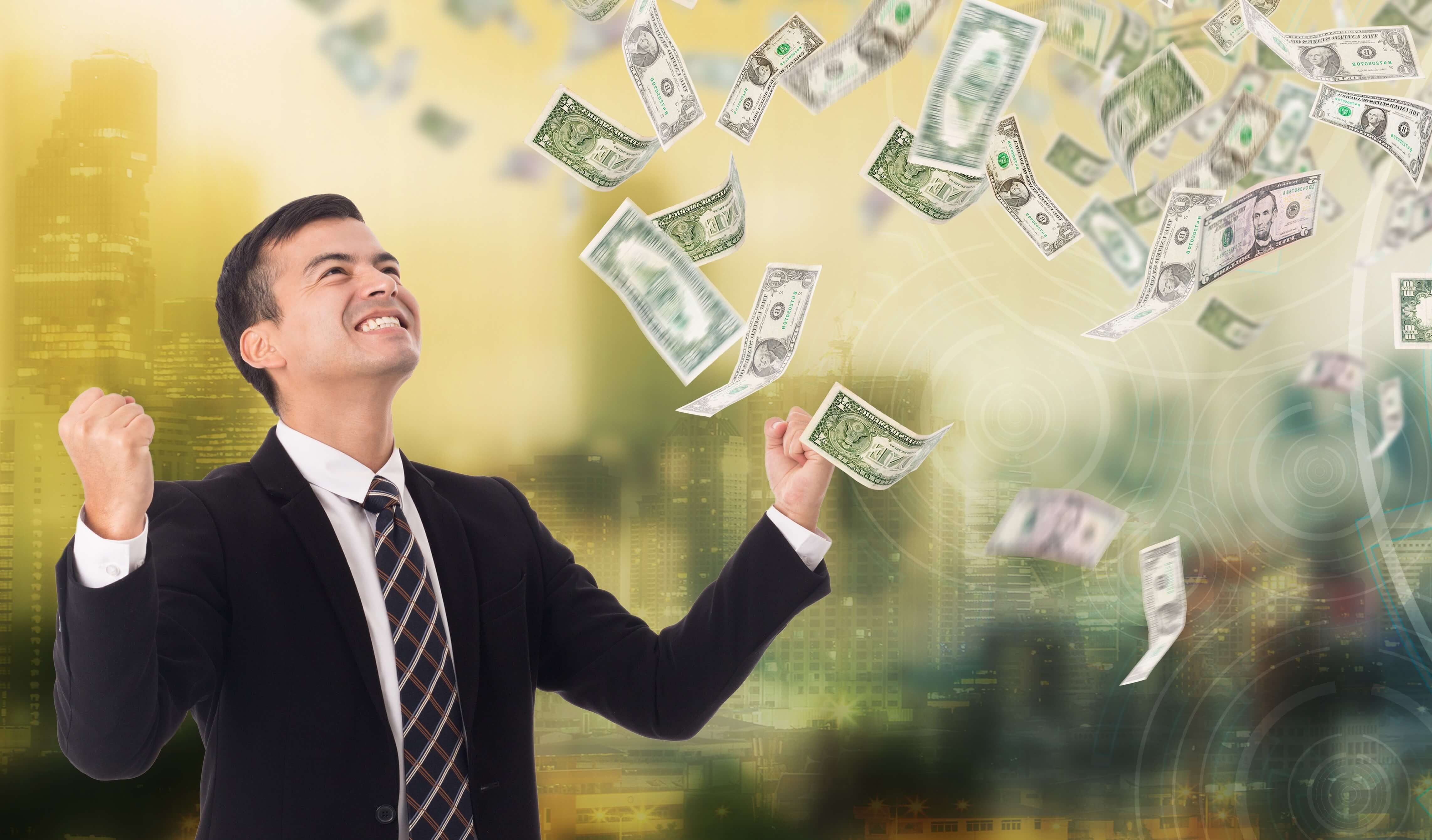 Save money on energy bills | business man happy about dollar bills swirling in the air