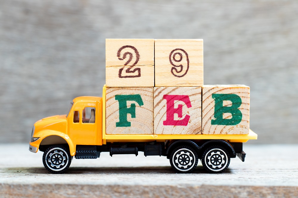 Leap Day Facts | Toy truck loaded with blocks spelling Feb 29 | Cost Control Associates