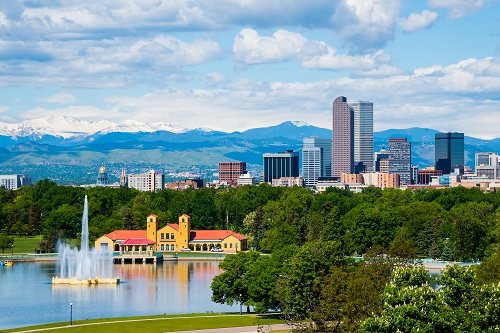 Why businesses measure GHG emissions | Denver skyline with park | Cost Control Associates